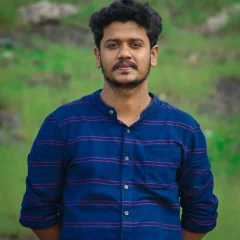 portrait-young-man-standing-outdoors