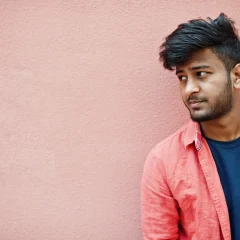 portrait-young-stylish-indian-man-model-isolated-pink-wall-background