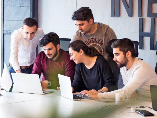 colleagues-working-project-discussing-details