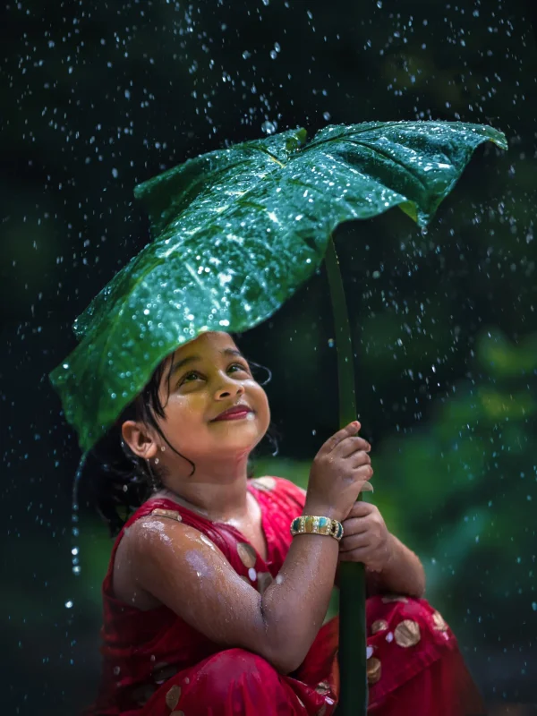 portrait-smiling-girl-holding-umbrella-rainy-season